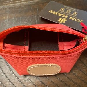 This is a Jon hart pod pouch with a coral coated canvas.